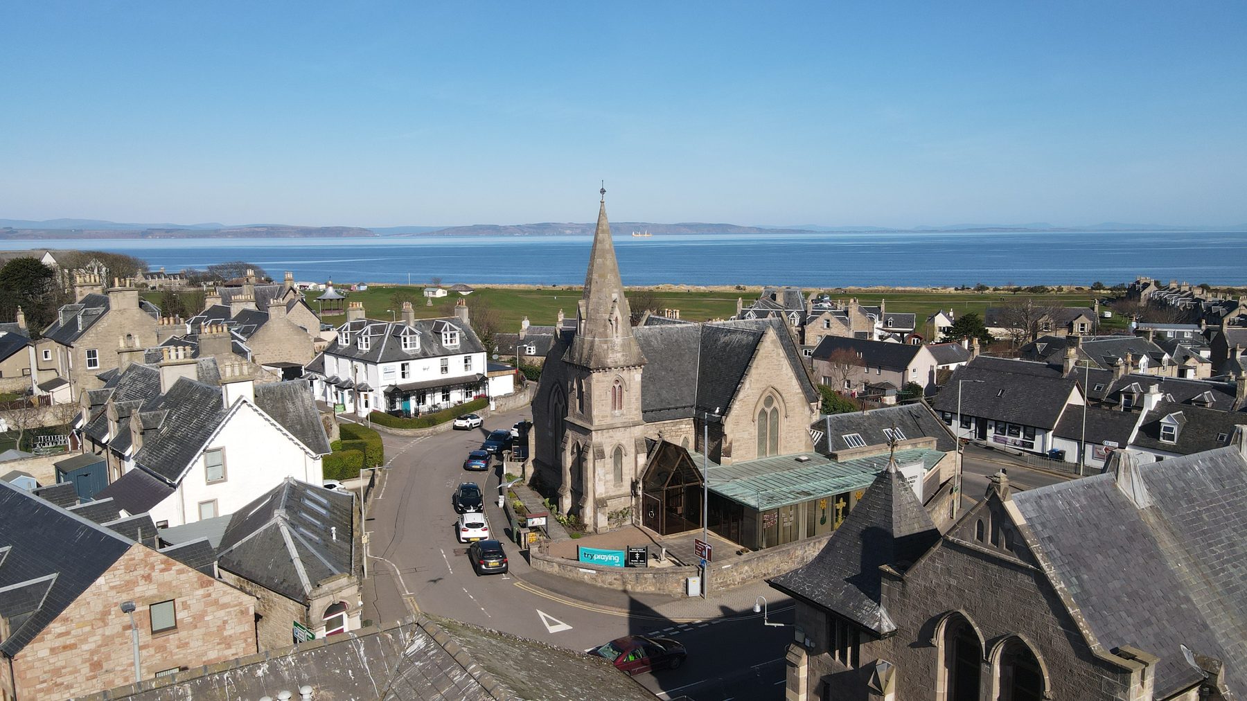 Nairn town rooftops and church spire from above