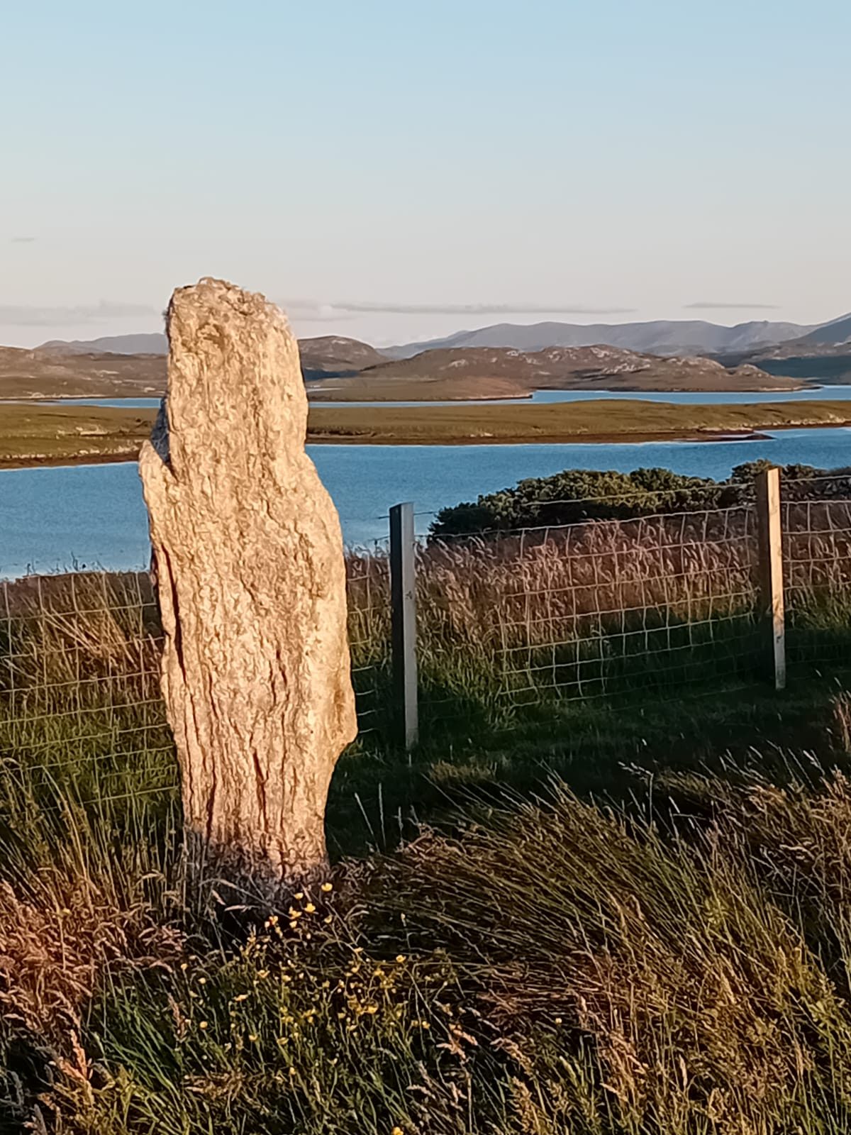 Standing stone overlooking a sea loch, Harris